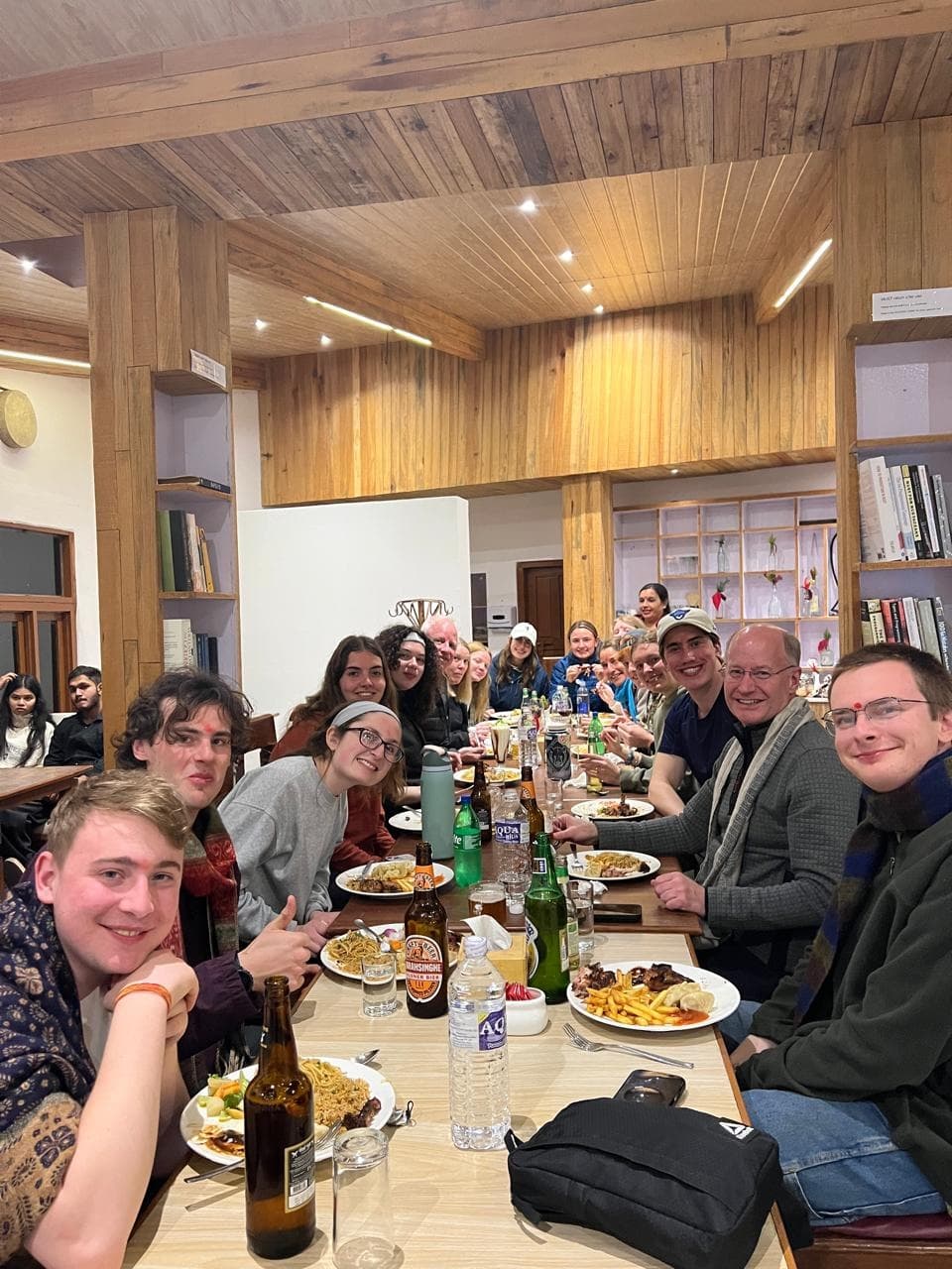 The group at dinner around a long table at Superview Lodge, Sarangkot