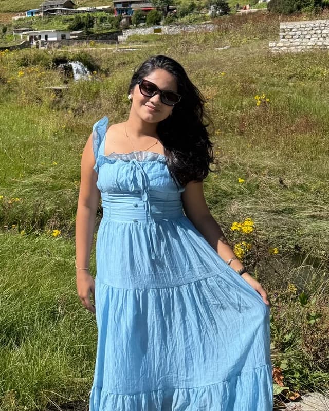 Sadikshya Sharma in a meadow in the Nepal hills